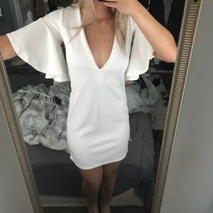 White plunge ruffle sleeve dress